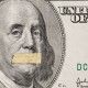 Silente president, portrait of the American leader Benjamin Franklin with mouth closed on the banknote of one hundred dollars, as a symbol of the instability of the modern economy