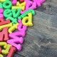Many letters word on wooden table