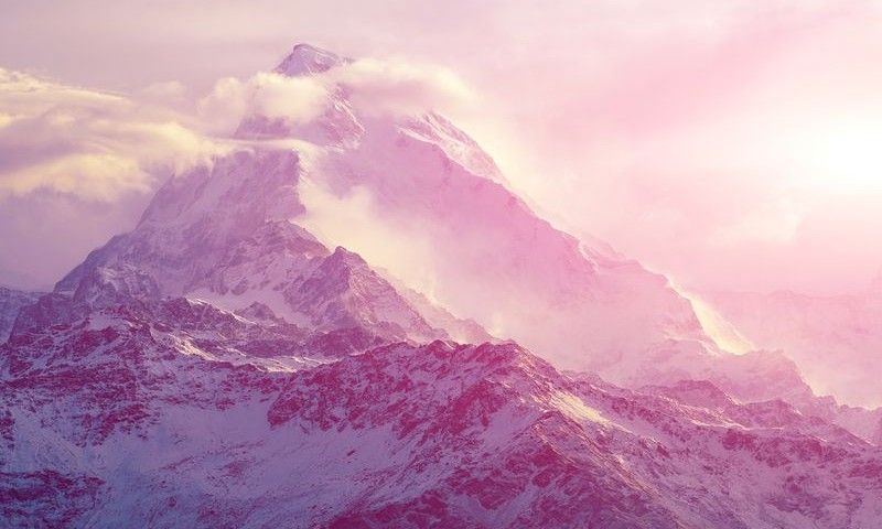 beautifull cloudy sunrise in the mountains with snow ridge. Trek around Annapurna mount. Himalaya, Nepal.