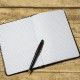 empty notebook on a wooden table