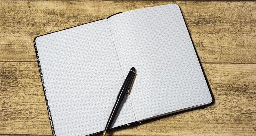 empty notebook on a wooden table