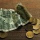 money and paper on a brown wooden background.The concept of poverty