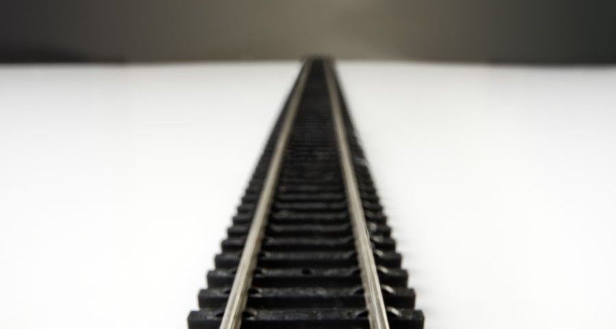 close up shot of a toy railway line going of into the distance