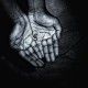 African hands with coins