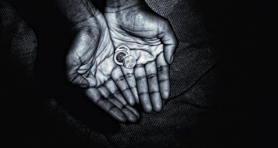 African hands with coins