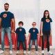 Young Family In Superhero Suits. Posing Concept. Masks And Raincoats. Bright Room. Resting Together. Save The World. Get Ready. Hand In Hand. Kids With A Parents. Active Lifestyle.