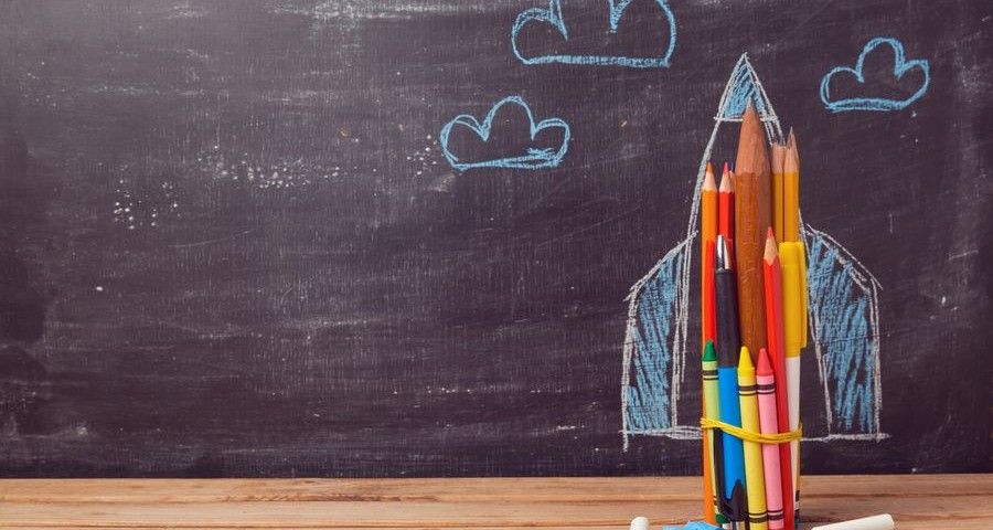 Back to school background with rocket made from pencils