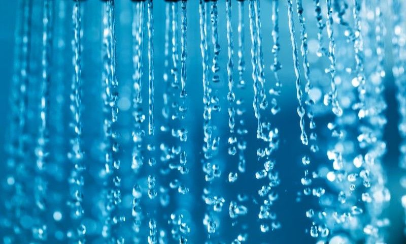 Clear water flowing from shower in a bathroom